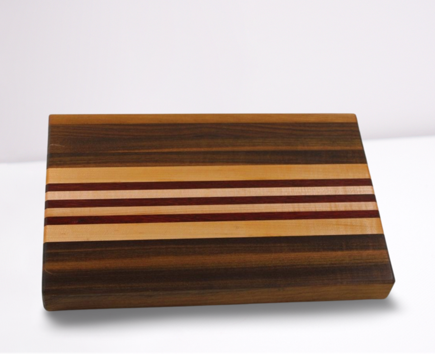 Wooden cutting board with striped pattern on a white background