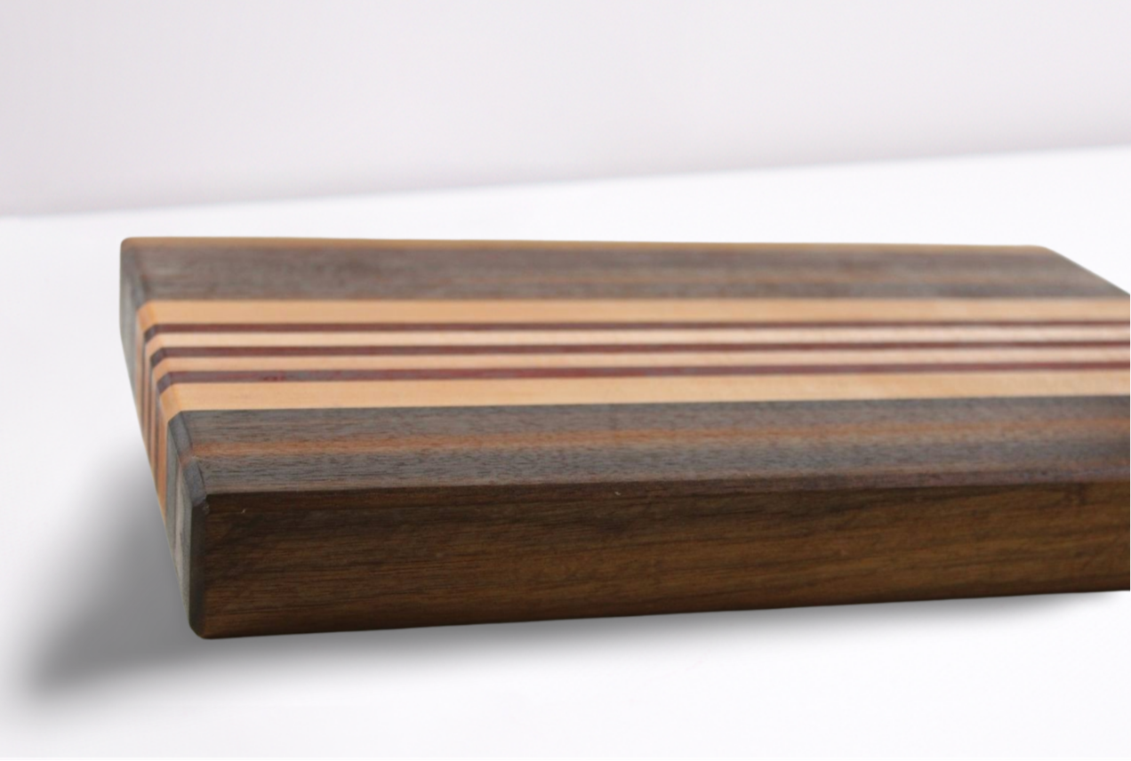 Wooden cutting board with striped pattern on a white background