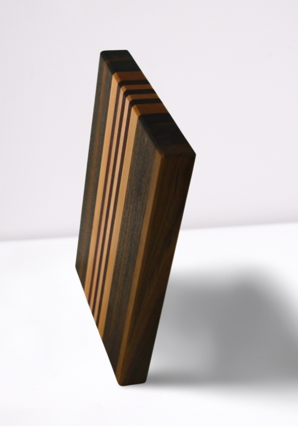 Wooden cutting board with a geometric design on a white background